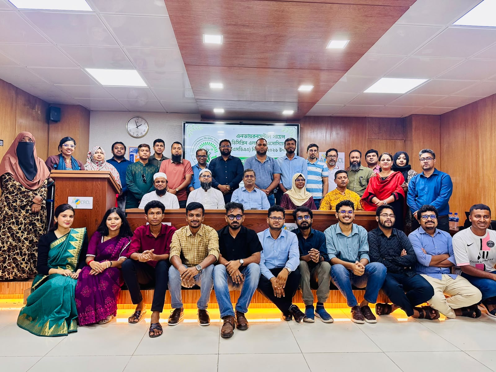 ES community members gathered for a group photograph indoors